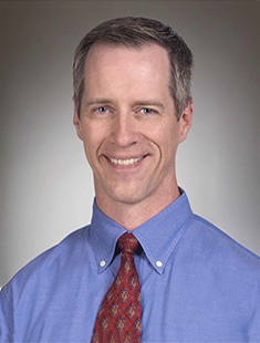 Mark E. Benden
