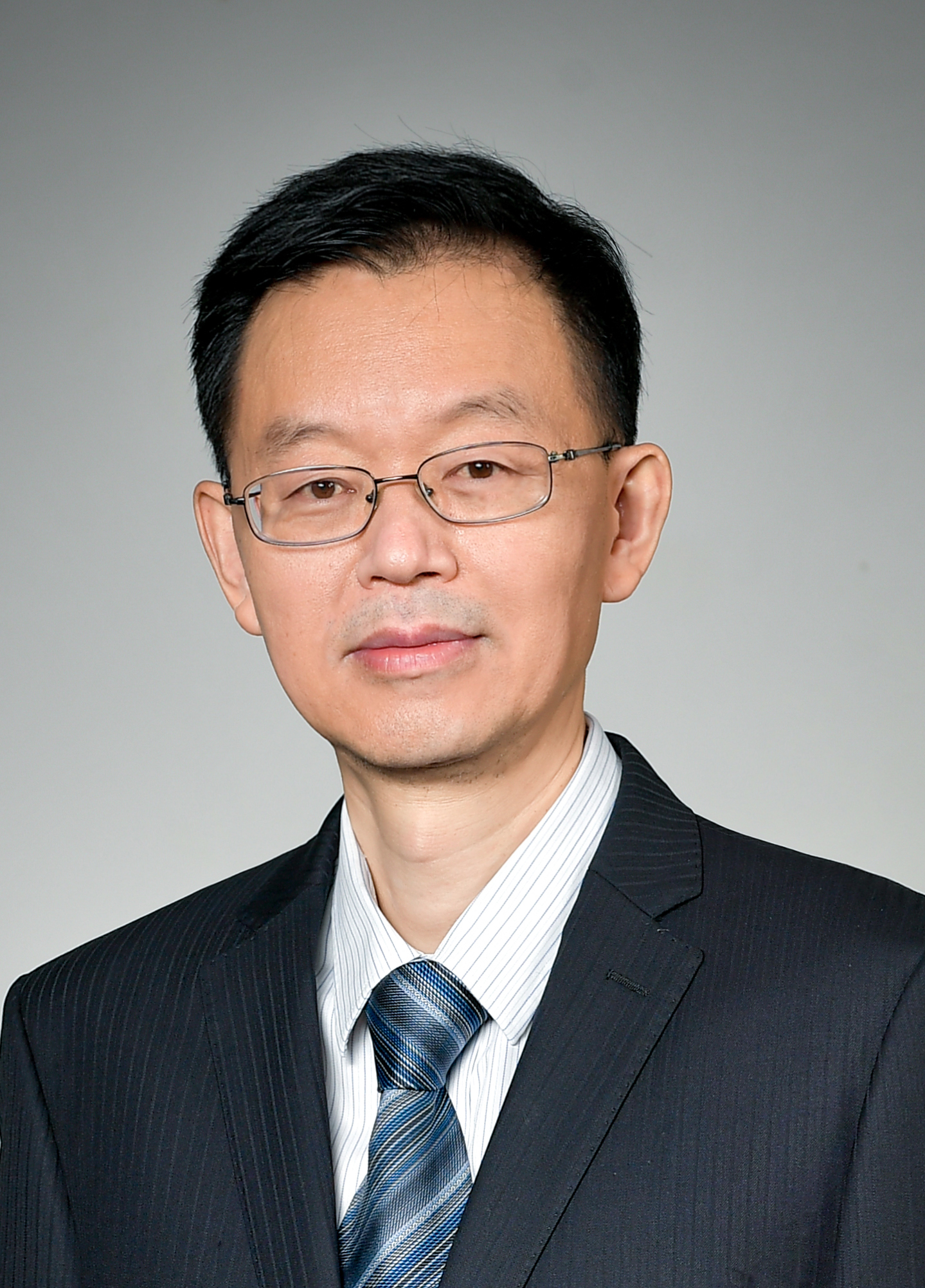 Xinping Guan