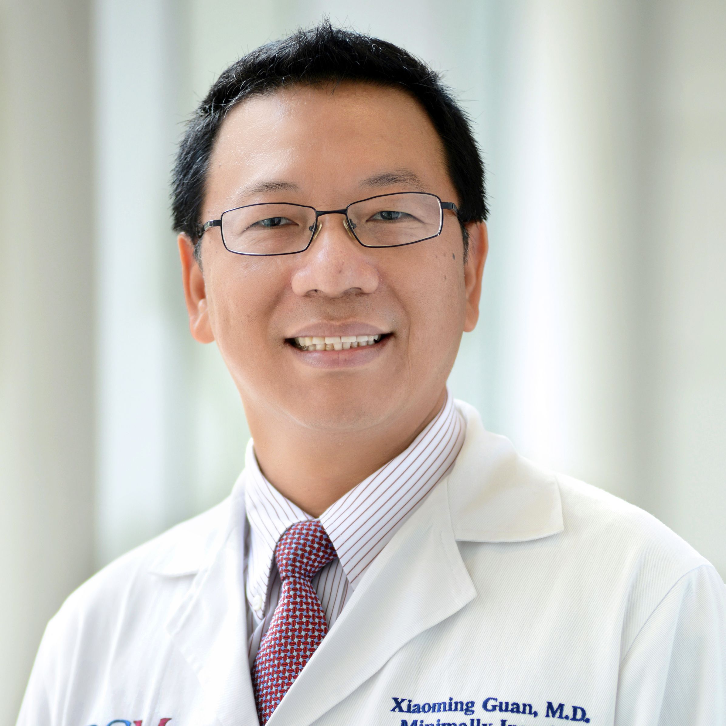 Xiaoming Guan